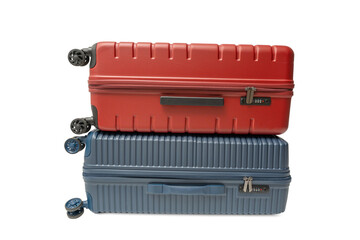Red suitcase stacked on top of a blue suitcase on a transparent background in PNG format. Both are...