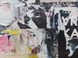 Fototapeta premium Torn and ripped street poster background, abstract retro paper collage