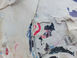 Fototapeta premium Torn and ripped street poster background, abstract retro paper collage
