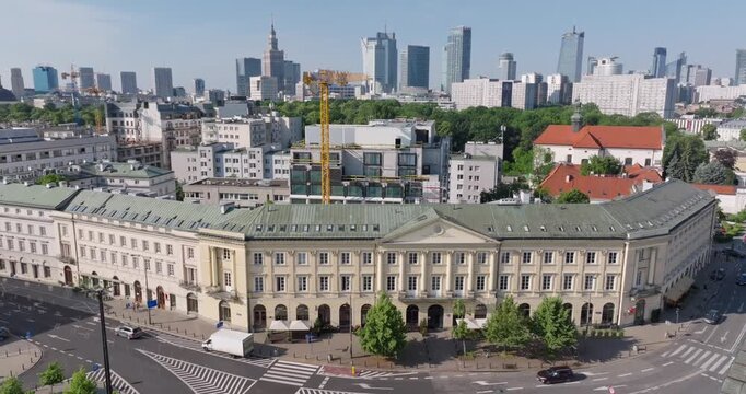 Aerial view of the historic &lsquo;Plac Teatralny&rsquo; building at the Wierzbowa&ndash;Senatorska intersection in Warsaw, set against a backdrop of modern high-rises, illustrating the city&rsquo;s architectural evolution.