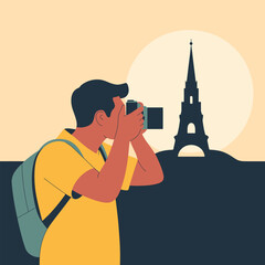 Tourist taking a photo of the Eiffel Tower silhouette in Paris Keywords: tourist, photographer