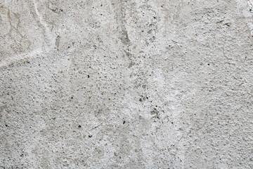 A textured gray wall with a rough, uneven surface, perfect for a modern or industrial design background.