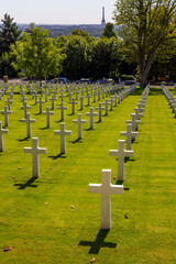 ombstones at the Suresnes American Cemetery in Suresnes with the Eiffel tower in the background