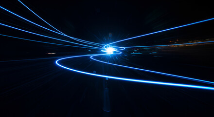 Abstract blue light trails against a dark backdrop, representing energy and motion