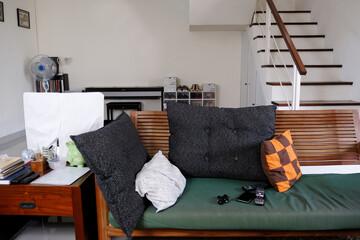 Untidy living room of a simple interior of an Indonesian house