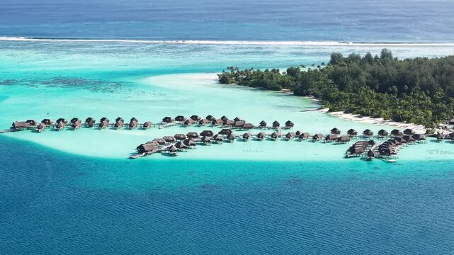 Bora Bora Island Resort, French Polynesia. Drone Shot of Bungalows Over Lagoon Water