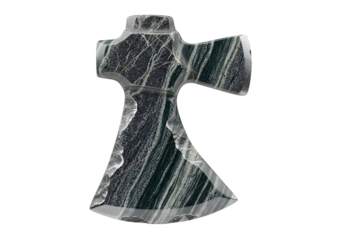A meticulously carved stone axe head, displaying intricate patterns and veining, is presented against a stark black backdrop.