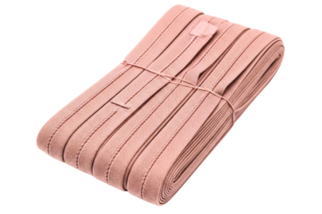 Folded bundle of pink fold-over elastic for sewing projects isolated on a transparent background