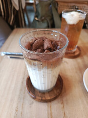 Gourmet Iced Coffee with Chocolate Cereal Topping in a Ribbed Glass