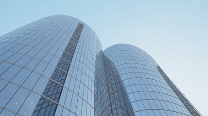 Twin glass skyscrapers with curved facades and blue reflections

