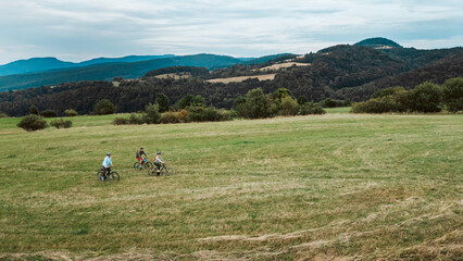 Young family on biking trip in nature.