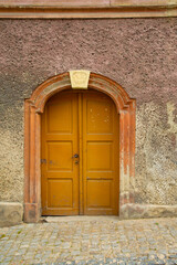 Fototapeta premium Urban architecture. Background. An wooden door in old building. Srebrna Gora, Lower Silesia, Poland
