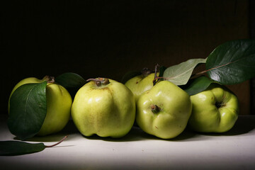 Still life with a whole fresh quince