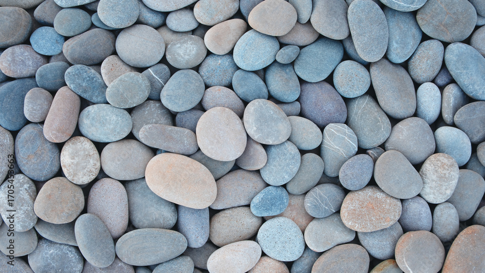 Poster pebbles stones on seashore as texture background for design web banner template page. many stones an