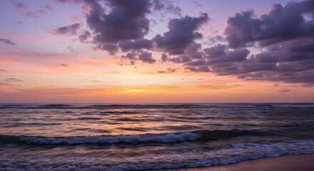 Obraz premium Stunning ocean sunset with vibrant colors reflecting on gentle waves at dusk provides calming scene