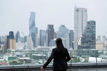 Asian business woman on the top roof