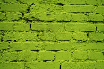 Mur de briques peint en vert.