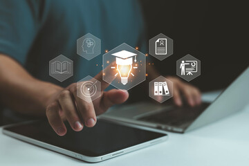 Hand using digital tablet with education icons, online learning technology, e-learning platform, knowledge innovation, smart study concept for modern digital education and professional development.