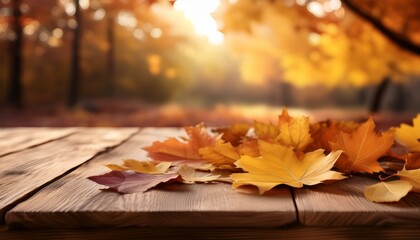 Obraz premium Beautiful Autumn Leaves Scattered On A Rustic Wooden Table Creating A Warm Seasonal Atmosphere
