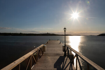 Amazing golden sunset over the Turku archipelago in south east Finland with a view on a typical...