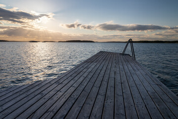 Amazing golden sunset over the Turku archipelago in south east Finland with a view on a typical...
