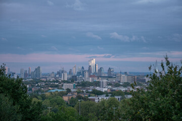 Panoramic view of London's financial district at dusk.