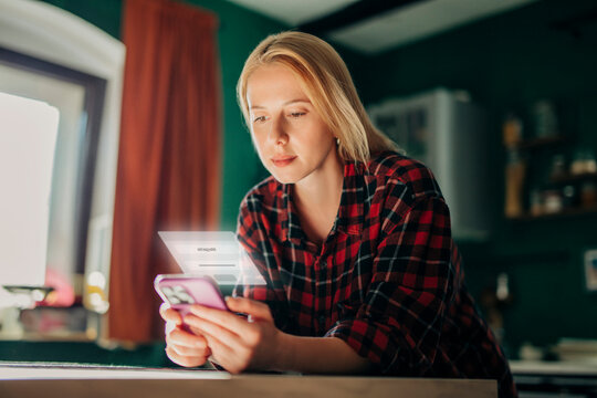 Woman verifying mobile identity login in home interior