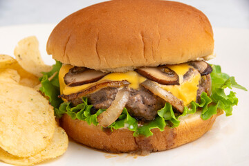 cheese burger top with onions and mushrooms