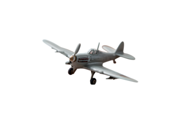 Silver world war ii fighter plane in flight against black background