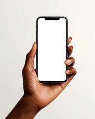 A hand holds a black smartphone with a blank screen against a light background