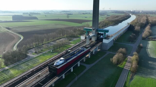 Fixed aerial camera shot of the Ronquieres ship lift in Belgium under bright sunny daylight with clear atmosphere.