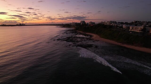 Vibrant Skies At Sunrise Over The Sea, Beach And Alexandra Headland In Queensland, Australia. - aerial shot