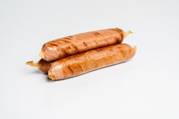 Fried grilled sausage isolated over a white background. Oktoberfest festival
