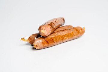 Fried grilled sausage isolated over a white background. Oktoberfest festival