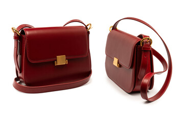 Burgundy shoulder leather bag isolated on white background.