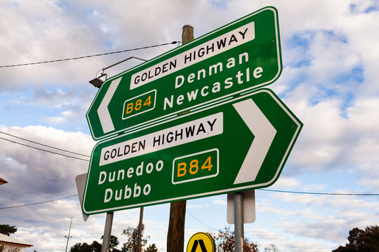 Green arrow sign along Golden Highway directions to Denman Newcastle and Dunedoo Dubbo