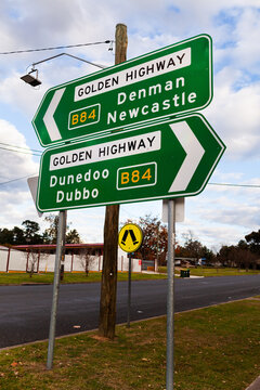 Green arrow sign along Golden Highway directions to Denman Newcastle and Dunedoo Dubbo
