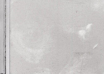Vintage dirty grunge film texture with fingerprints. Aged torn black scratched photo. Glitch effect.
