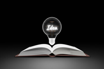A book on a table with a light bulb represents a box of ideas, learning, education, searching, and inspiration.