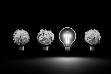 A lit light bulb and paper clump light bulb: The lit bulb represents thinking, leadership, success, ideas, and inspiration.