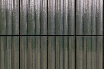 Metallic textures and reflections create a captivating pattern in the urban landscape during a cloudy afternoon