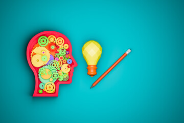 A head frame with gears inside represents thought and planning, while a light bulb symbolizes ideas, and a pencil represents learning.