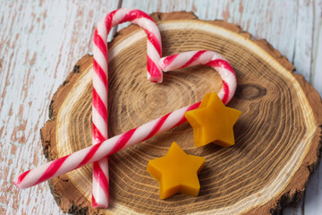 Candy Canes with Star Beeswaxes on Wood Slice