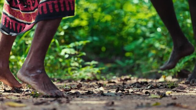 Vedda tribesman of Sri Lanka dancing a ritual dance before hunting, traditional lifestyle, and connection to nature. Tribal portrait in native Habitat 120 fps slow motion.