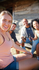Group Of Friends Drinking Beer Posing For Selfie On Mobile Phone On Vacation Hiking In Countryside