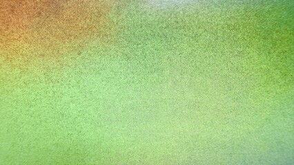 vibrant green and orange gradient fabric texture with fine dotted weave creating abstract organic surface for modern wallpaper or banner background