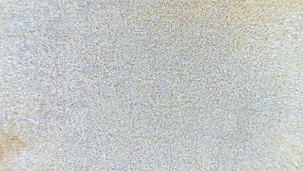 abstract textured fabric surface with soft pastel speckles in yellow and lavender tones perfect for wallpaper or minimalist banner background