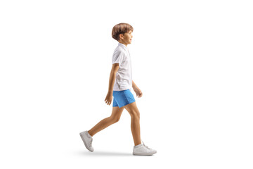 Full length profile shot of a boy in white t-shirt and blue shorts walking © Ljupco Smokovski