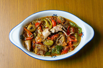 Cumi Asin Cabe Hijau, Salted Squid with Green Chili,  traditional Indonesian dish. Made from salted, dried squid that is stir-fried with green chilies, green tomatoes, and various spices. 