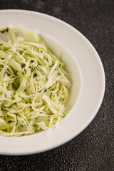 Cabbage salad coleslaw vegetables dish natural product tasty snack fresh delicious gourmet food background on table rustic top view copy space keto and paleo diet vegan and vegan food
